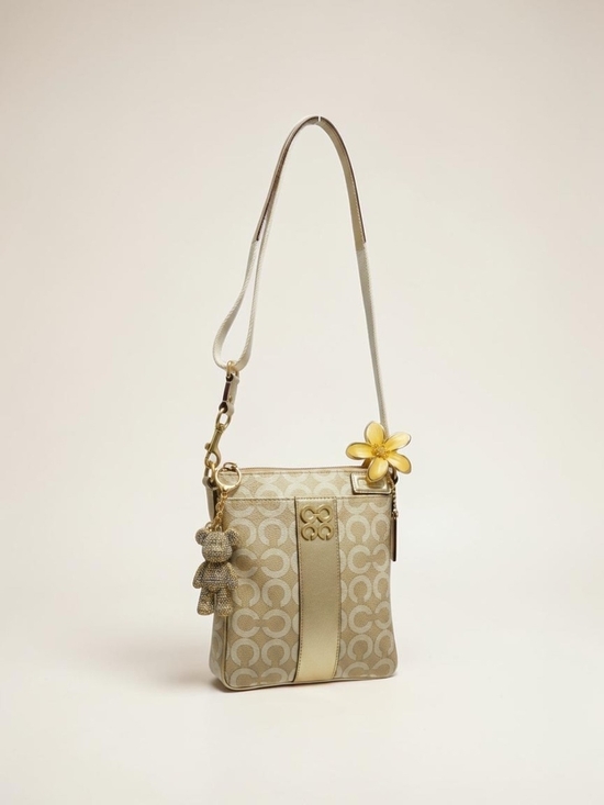 Coach Handbags - Coach Beige and Gold Signature Crossbody with Floral Charm
